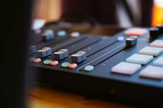 Mixing desk with buttons reminiscent of the filters in the app